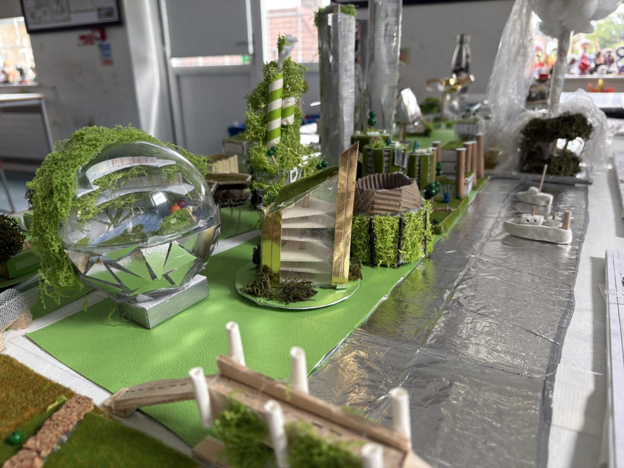 View down the Thames, showing The Bubble Emporium Library and Globe theatre with living walls