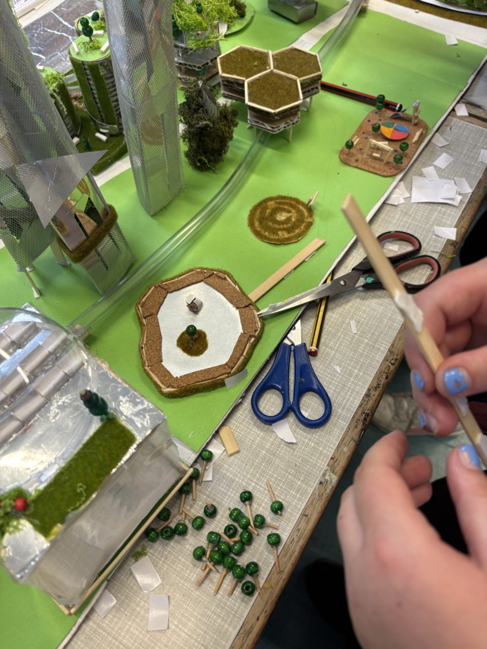 As the project draws to a close, children begin to add the finishing touches.